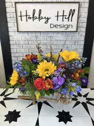 Blooming Wheelbarrow from your Sebring, Florida florist